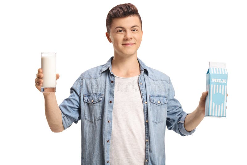 Teenage boy with a glass of milk and a milk carton. 