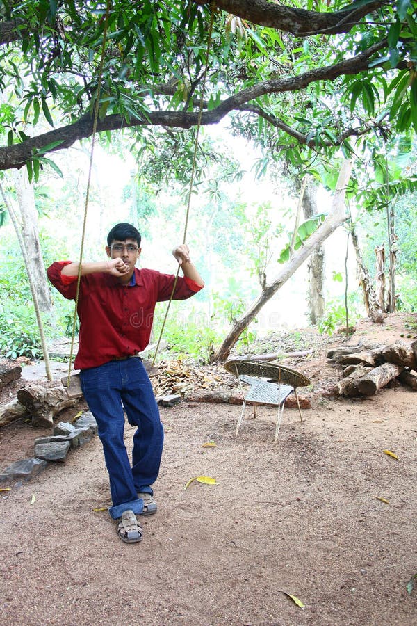 Teenage Boy on a Rope Swing