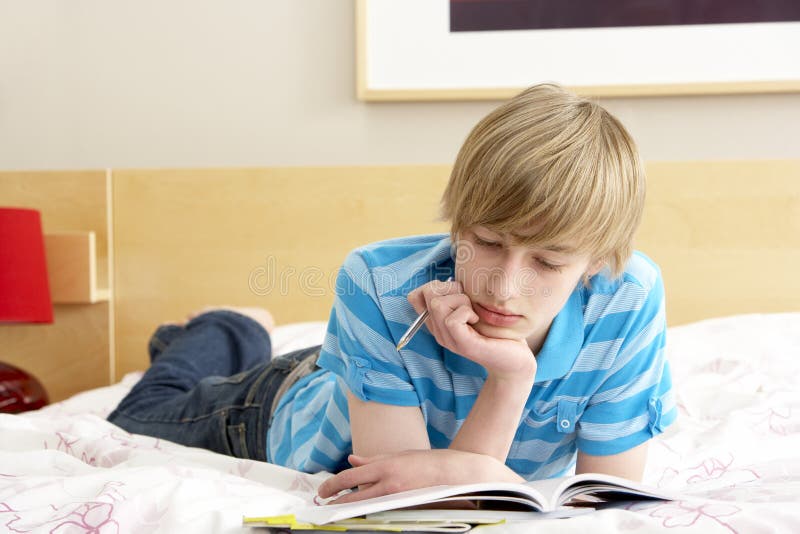 Boy Playing Video Game instead of Studying Stock Image Image of