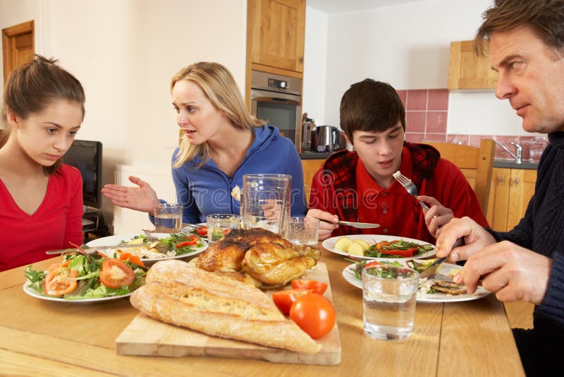 Teenage Family Having Argument Whilst Eating Lunch royalty free stock photos Teenage Family Having Argument Whilst Eating Lunch royalty free stock photos