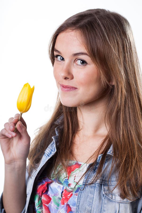 Teenage girl holding yellow tulip stock image Teenage girl holding yellow tulip stock image