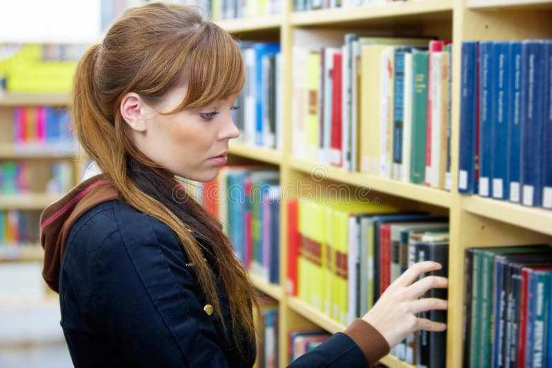 Teenage Girl in Library royalty free stock photo