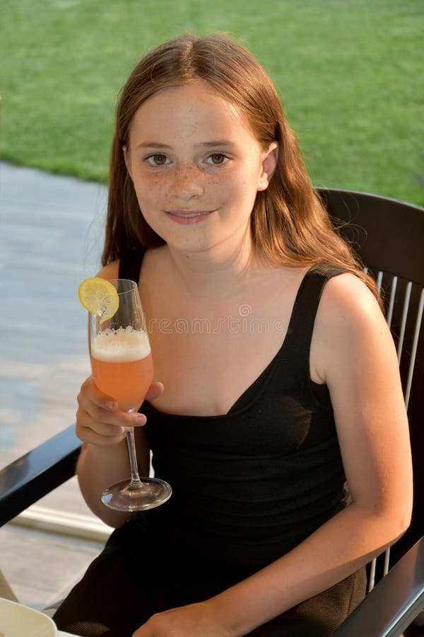 Teenage girl with non alcoholic cocktail