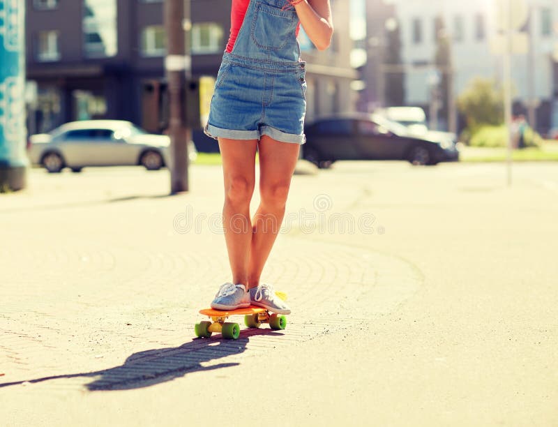 Teenage Girl Riding Skateboard on City Street Stock Photo - Image of ...