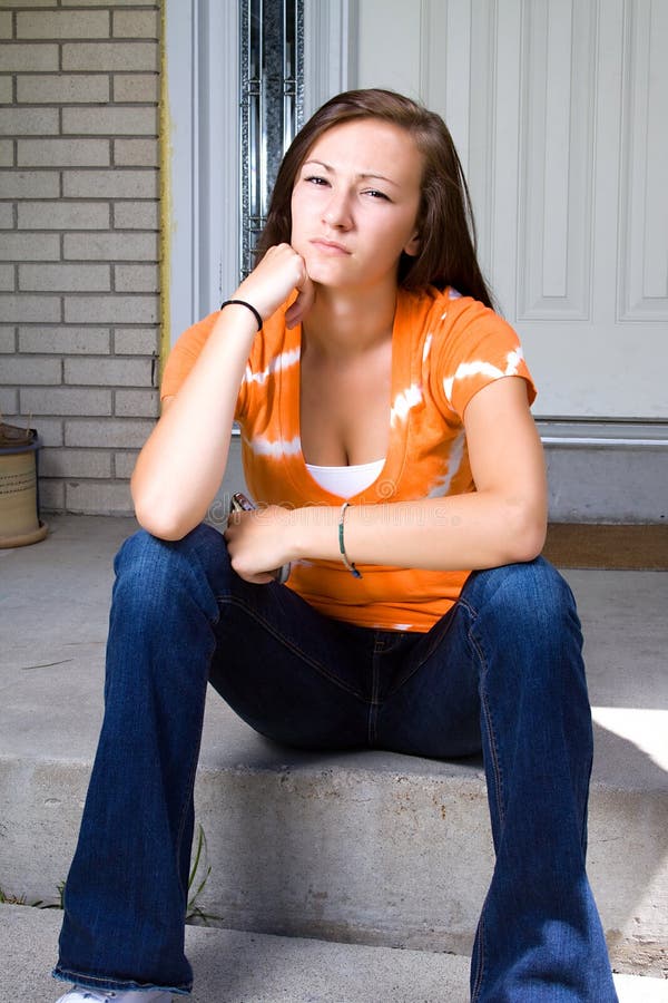 Teenage Girl Sitting Outside stock photo