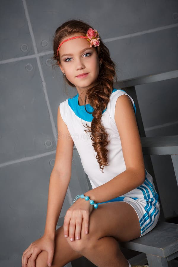 Teenage girl sitting in studio