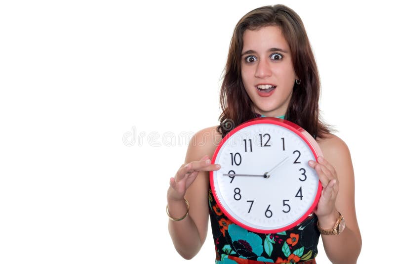 Teenage girl with a surprised expression showing the time on a big clock royalty free stock photo Teenage girl with a surprised expression showing the time on a big clock royalty free stock photo