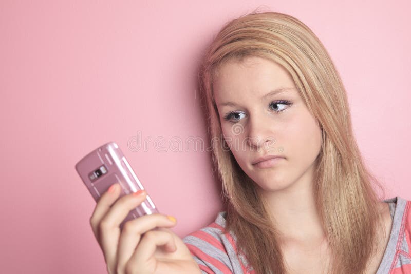 Teenage girl use cellphone in her room