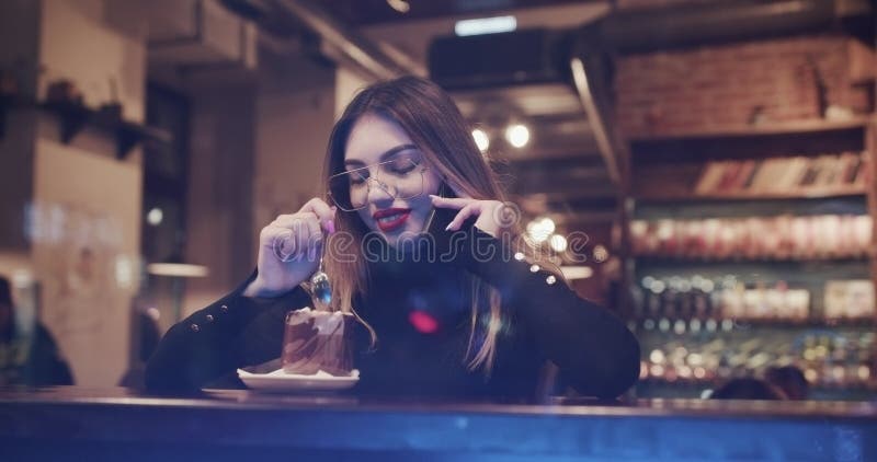 Beautiful Teenage Girl Using Smartphone in Cafe Texting Sharing Messages on Social Media Enjoying Mobile Technology