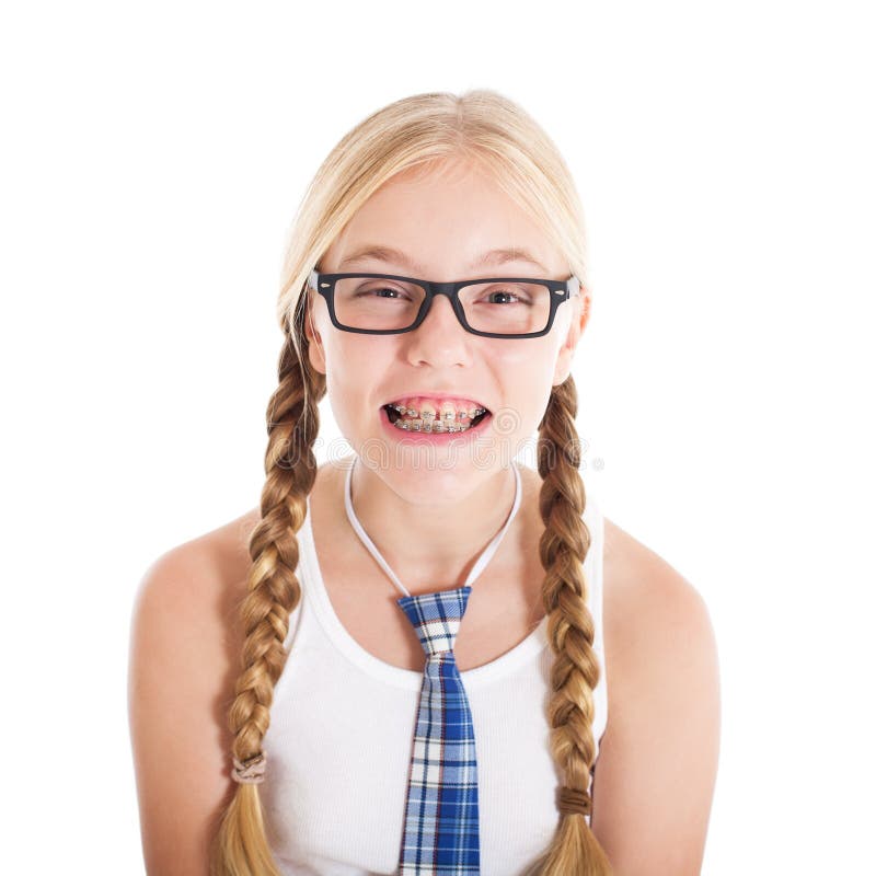 Teenage girl wearing a school uniform and glasses. Smiling face, braces on your teeth.