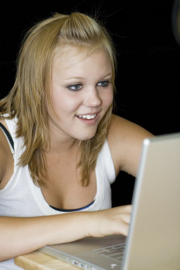 Teenage Girl working on laptop computer