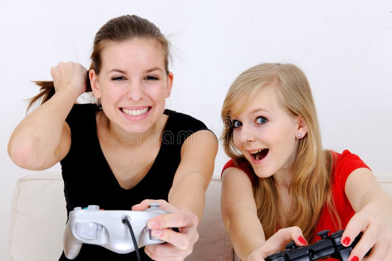 Best friends playing on playstation - Royalty free image #21436713