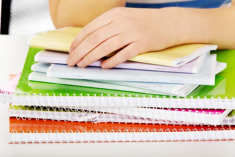 Teenage woman hand doing a homework royalty free stock photo