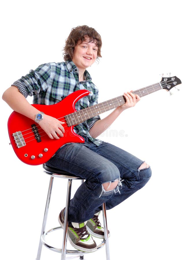 Teenager on Bass guitar sitting