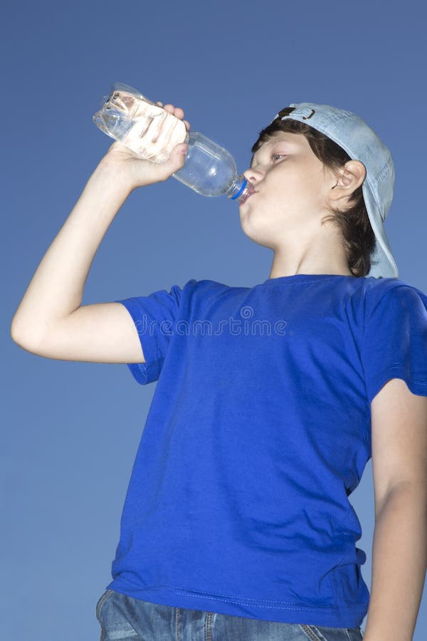 Boy Teen Drinking Bottled Water Stock Photo - Download Image Now - Bottle,  Casual Clothing, Child - iStock