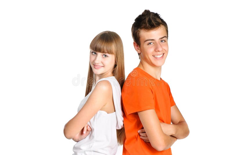 Teenager boy and girl smiling over white