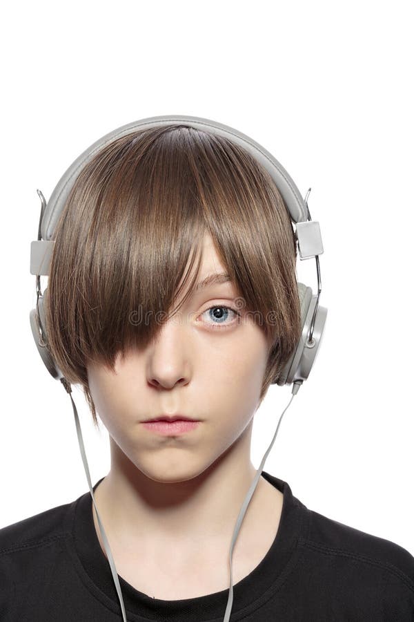 Teenager boy with hair over one eye and headphones royalty free stock photos Teenager boy with hair over one eye and headphones royalty free stock photos