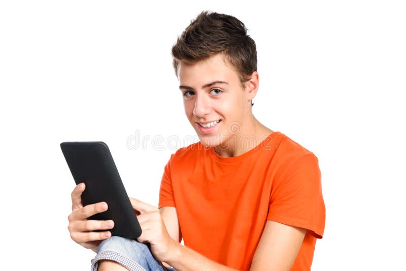 Teenager boy touching a tablet pc over white