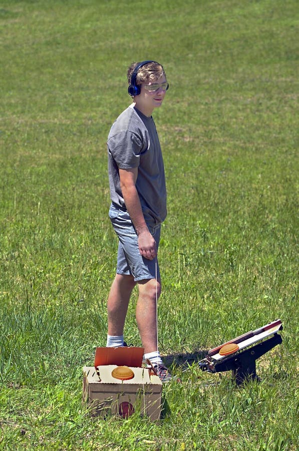 Teenager with Clay Shotgun Targets royalty free stock photos Teenager with Clay Shotgun Targets royalty free stock photos