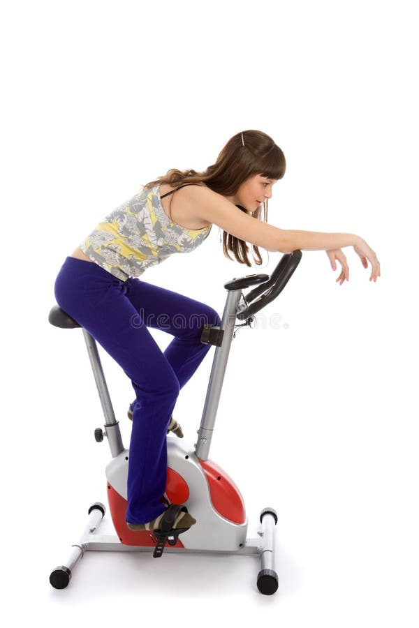 Teenager doing fitness on a stationary bike