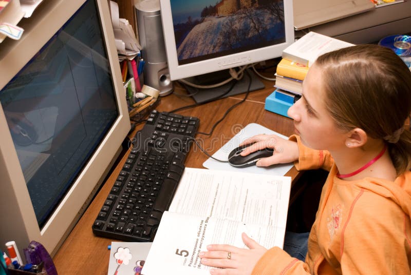 Teenager girl learning a computer stock photo Teenager girl learning a computer stock photo