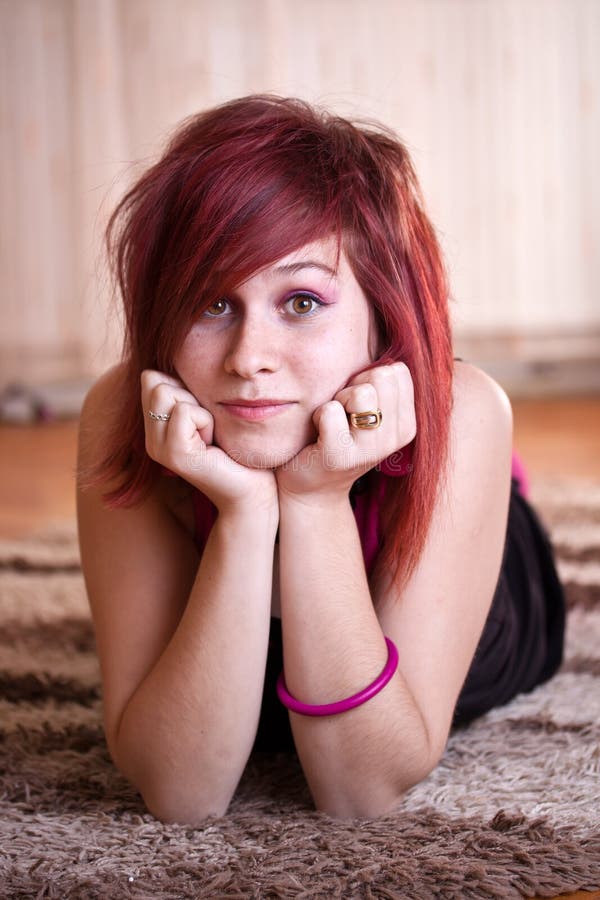 Teenager girl lying in floor stock image Teenager girl lying in floor stock image