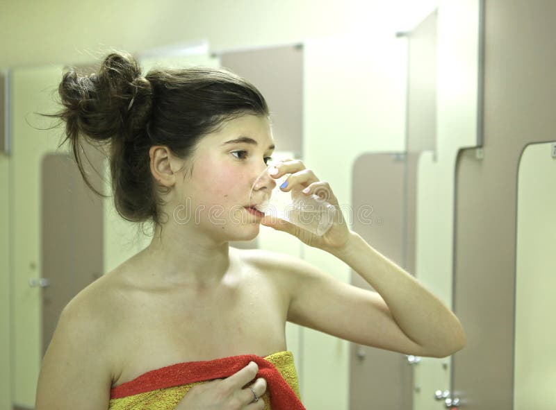 Teenager Girl with Towel and Water Glass after Shower Stock Image ... image