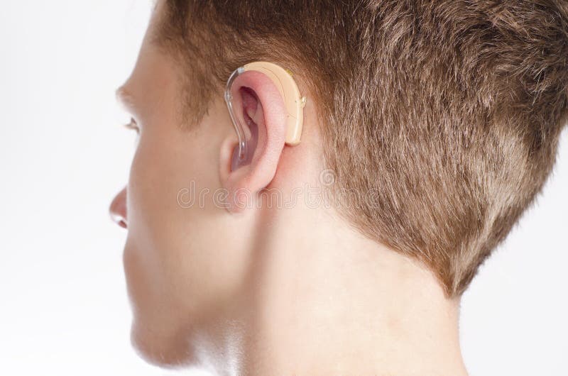 Teenager with hearing aid