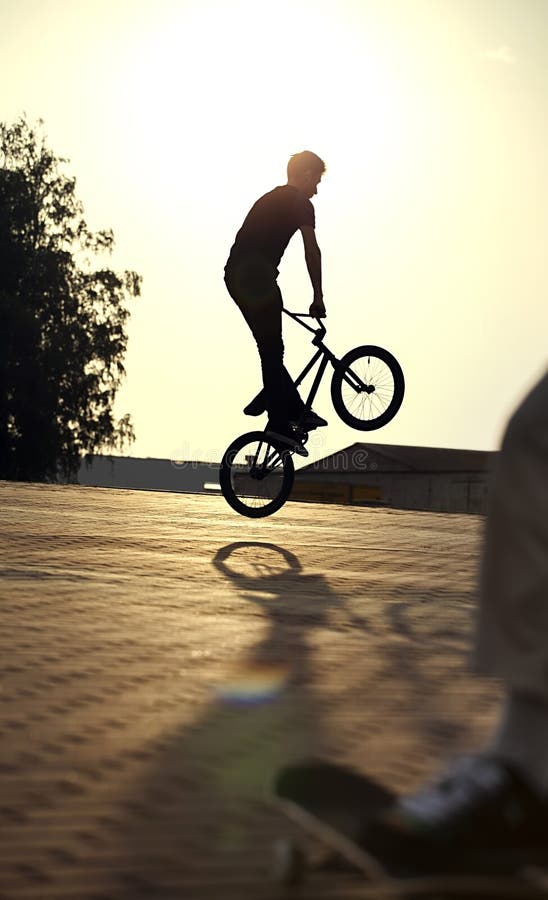 Teenager Jump On Bicycle Outdoors, Boy On Skateboard, Urban Style Stock