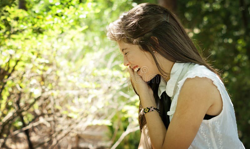 Teenager laughing in a park stock images Teenager laughing in a park stock images