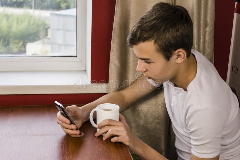 Teenager Looking at Smart Phone Stoc