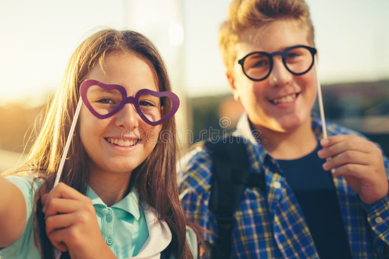 Teenagers holding happy glasses royalty free stock image