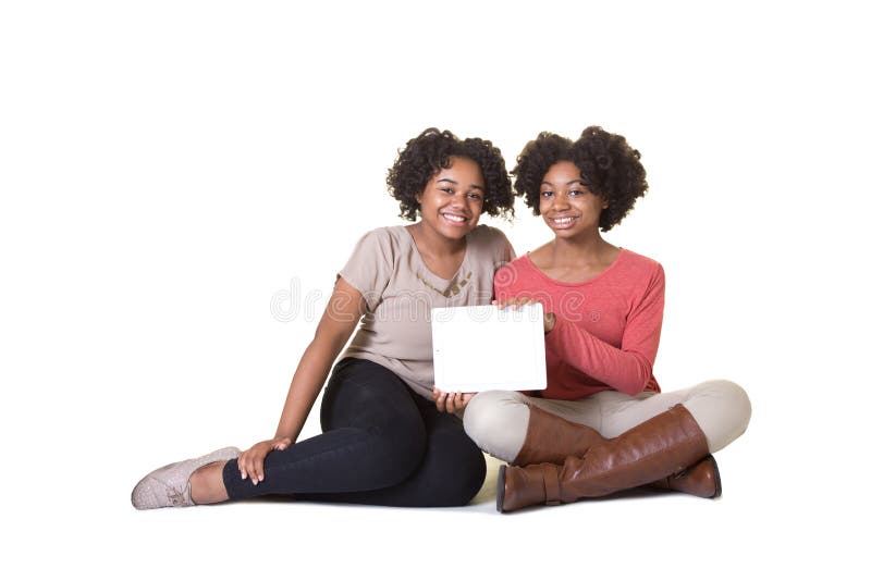 Teenagers holding a tablet stock photography