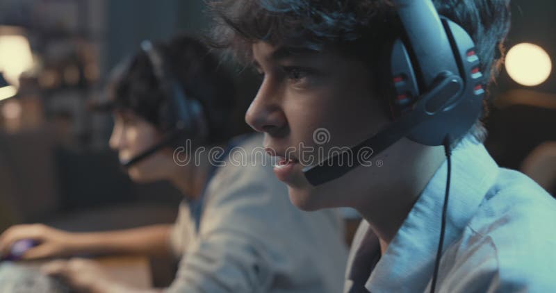Teenagers playing video games together stock video