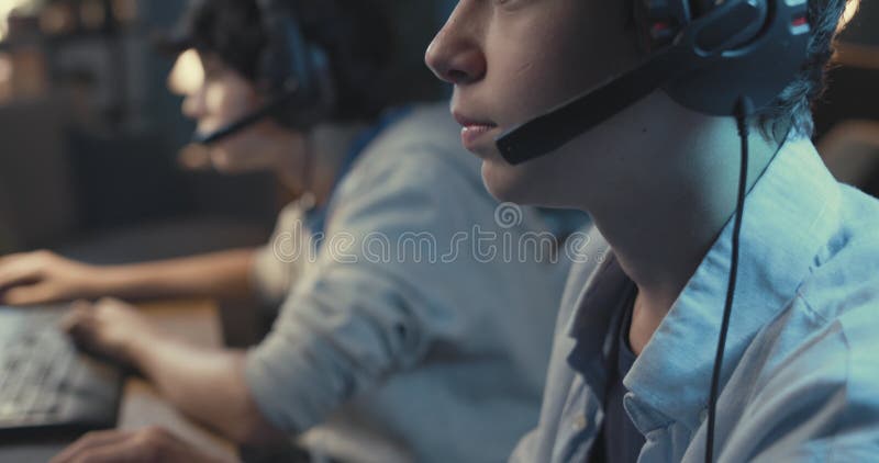 Teenagers playing video games together stock video