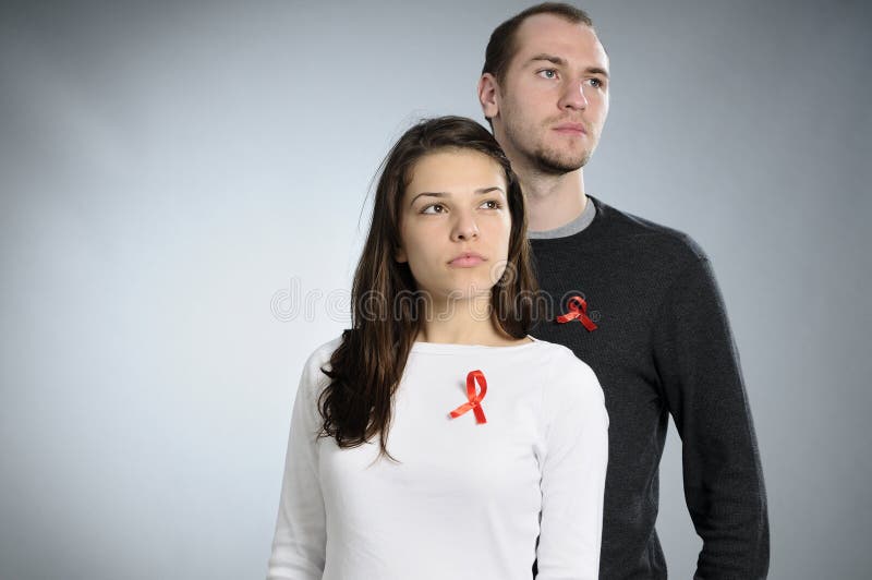 Teenagers showing hiv red symbol