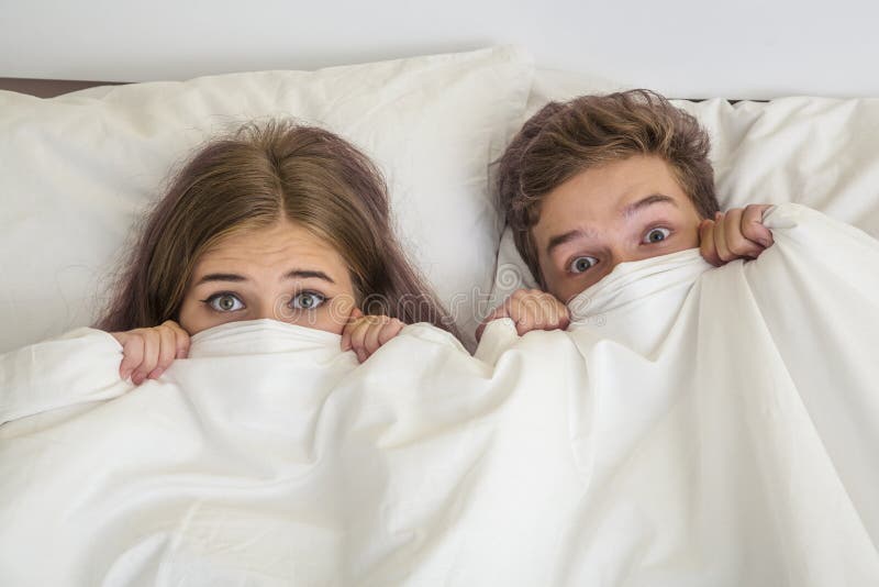 Teens boy and girl in bed