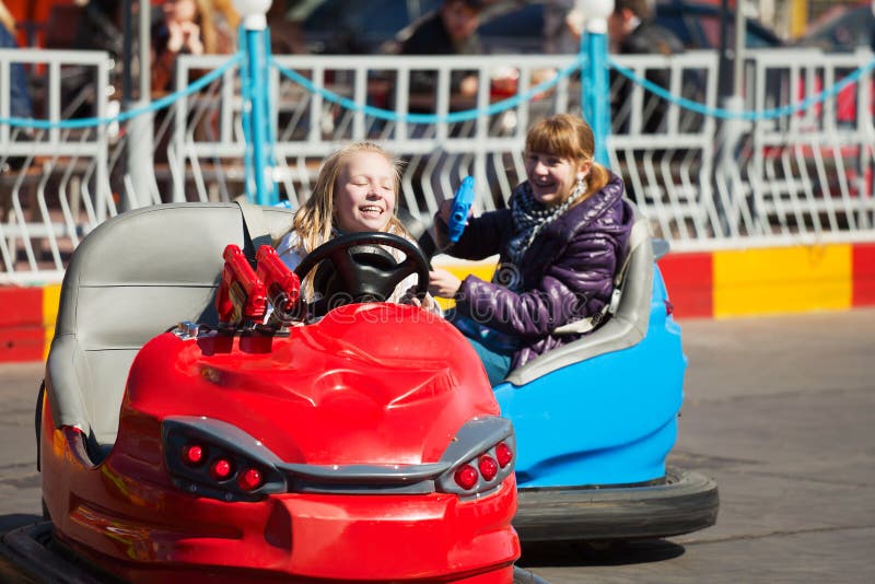 Young Girls Driving a Bumper Cars Stock Photo Image of leisure, girl