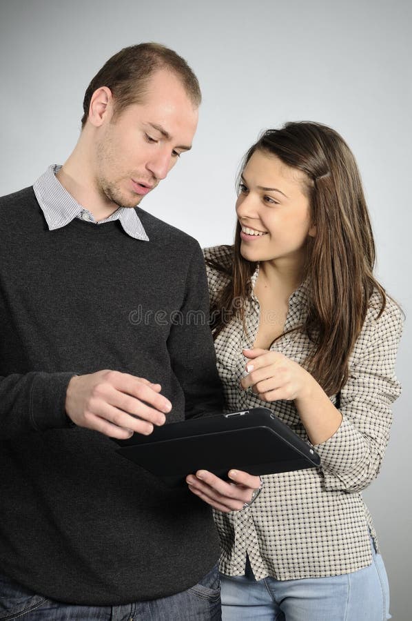 Teens learning from notebook