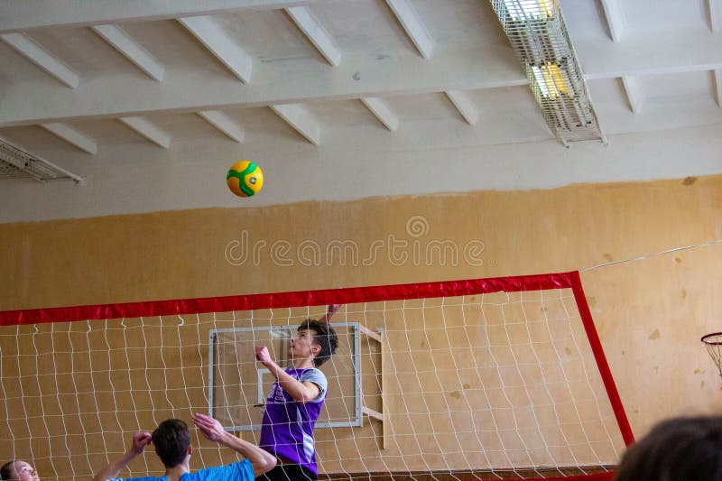 Teens Playing a Volleyball in the Gym Editorial Stock Image Image of