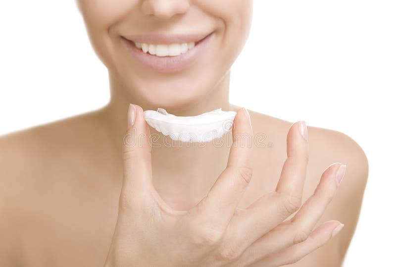 Beautiful smiling girl with tooth tray, isolated on white (hands holding individual tooth tray). Beautiful smiling girl with tooth tray, isolated on white (hands holding individual tooth tray)