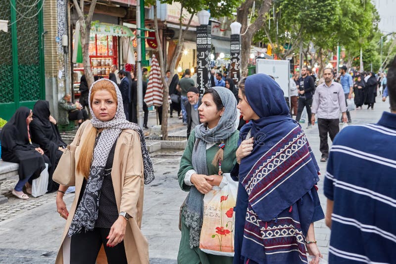 tehran-iran-april-iranian-women-hijabs-walk-along-street-shahre-rey-area-women-walk-streets-shahre-rey-area-tehran-109428218.jpg