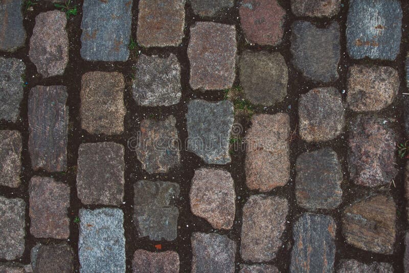 Tekstura stary brukowiec niezwykli kamienie i Wzorzysty brukowanie tafluje brukowiec drog? dla tekstury Odg?rny widok obrazy stock Tekstura stary brukowiec niezwykli kamienie i Wzorzysty brukowanie tafluje brukowiec drog? dla tekstury Odg?rny widok obrazy stock