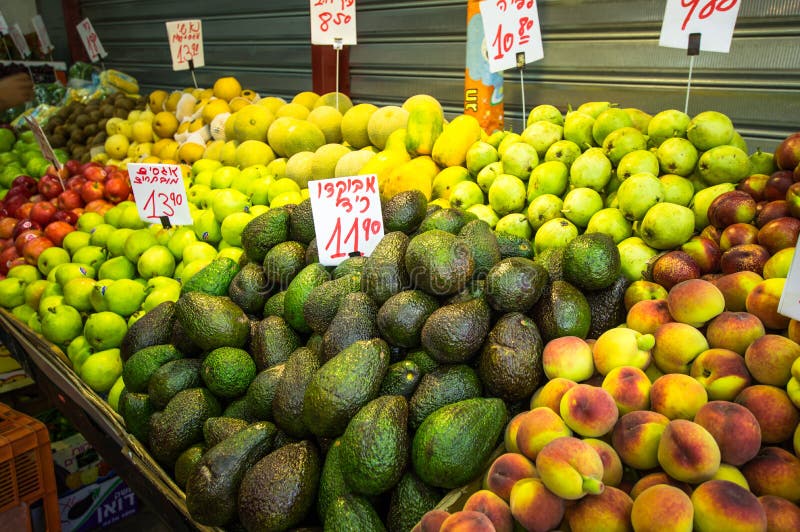 Tel Aviv, Israel - April 20, 2017: The fresh flavored colorful juicy fruits in the stall of the Carmel market stock images Tel Aviv, Israel - April 20, 2017: The fresh flavored colorful juicy fruits in the stall of the Carmel market stock images