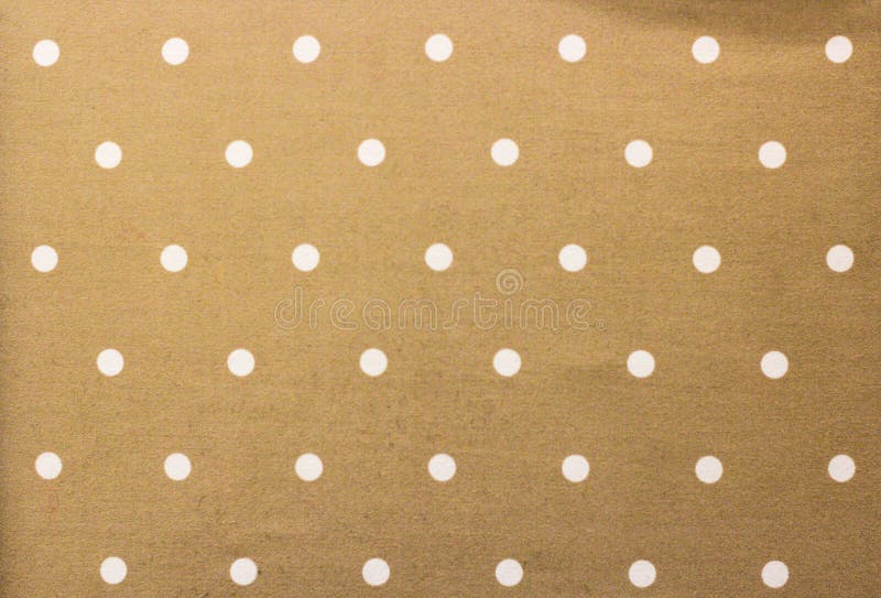 Tela de oro y un fondo minúsculo blanco de los lunares imagen de archivo Tela de oro y un fondo minúsculo blanco de los lunares imagen de archivo