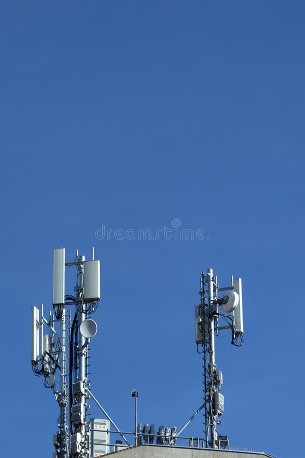 Telecom tower on a blue sky with copy space for your text