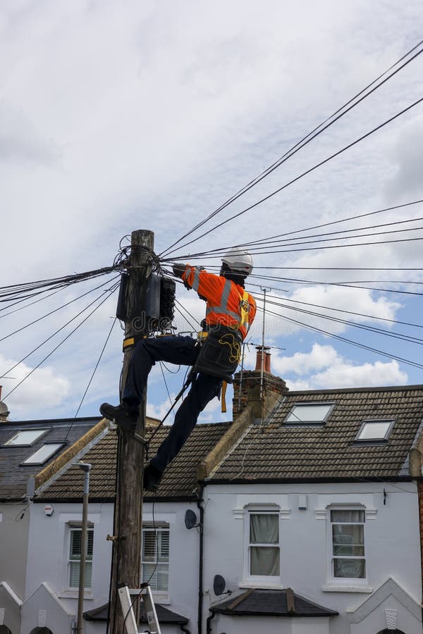Engineer Working on a Telephone Pole. Stock Photo