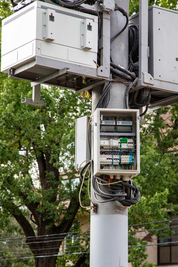 Telecommunications equipment and electrical panel on utility pole outdoors royalty free stock photography