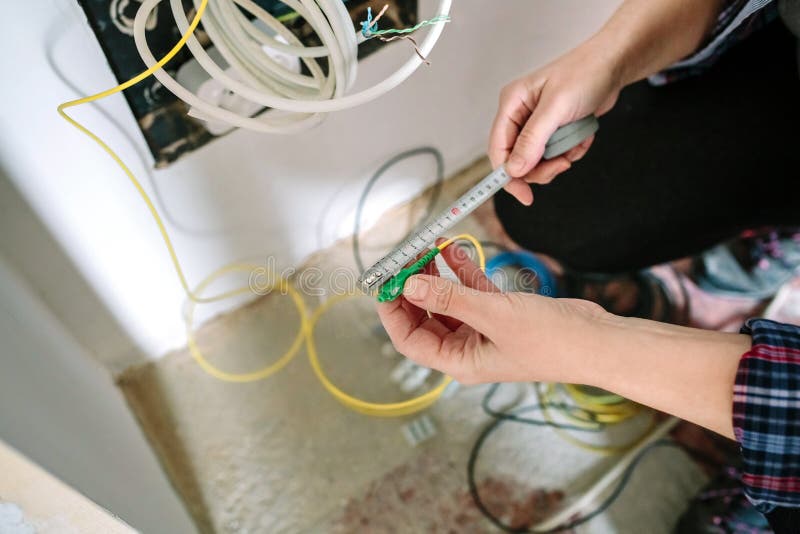 Installer Measuring Fiber Optic Cable Stock Photo