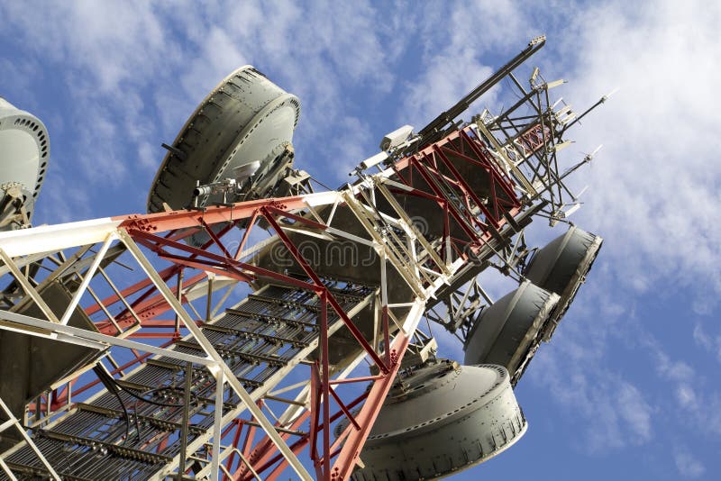 Telecommunications tower against blue sky